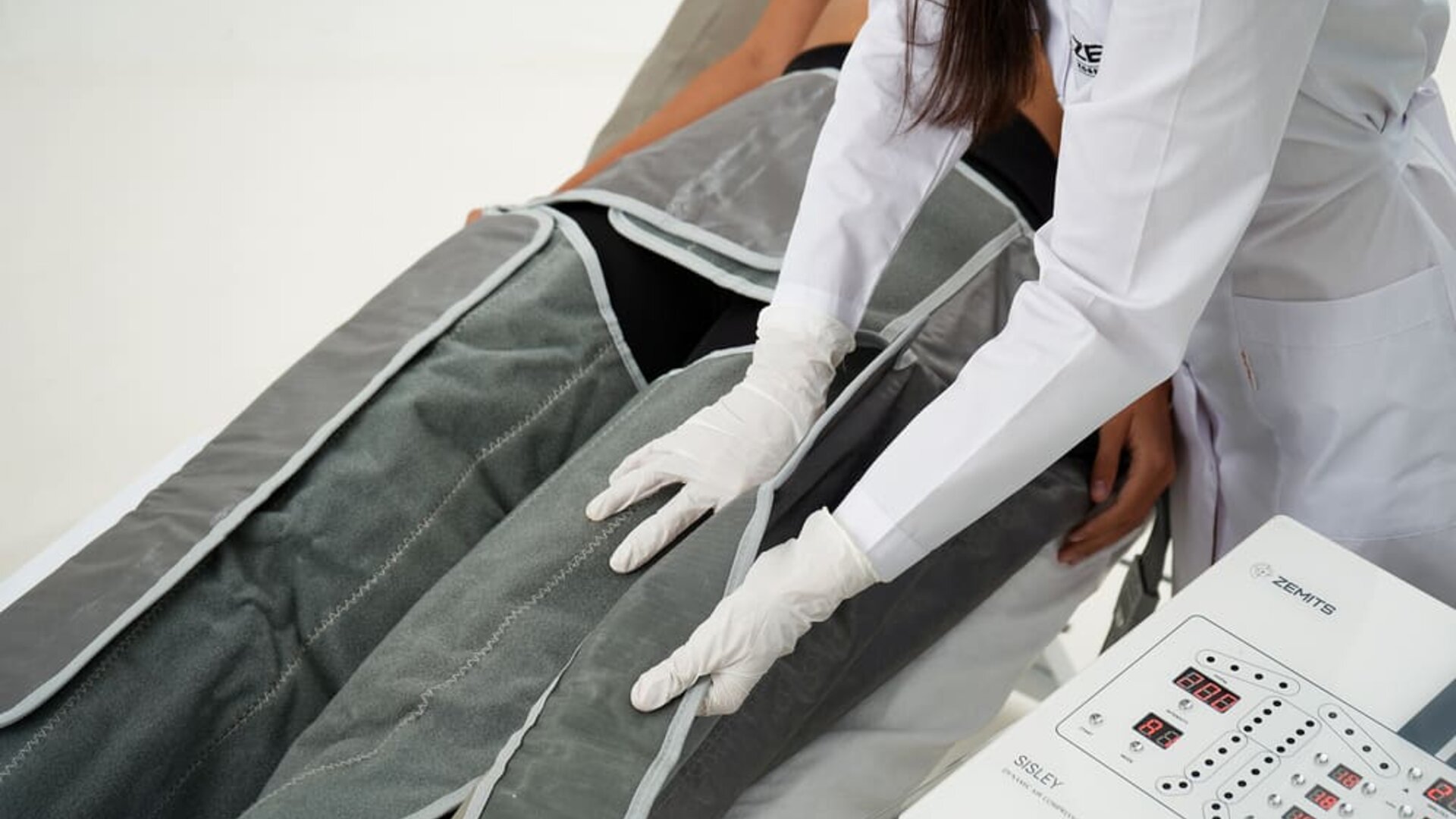 Spa wellness treatment at SKYLARANNA Resort & Spa, featuring compression therapy equipment administered by a spa professional.