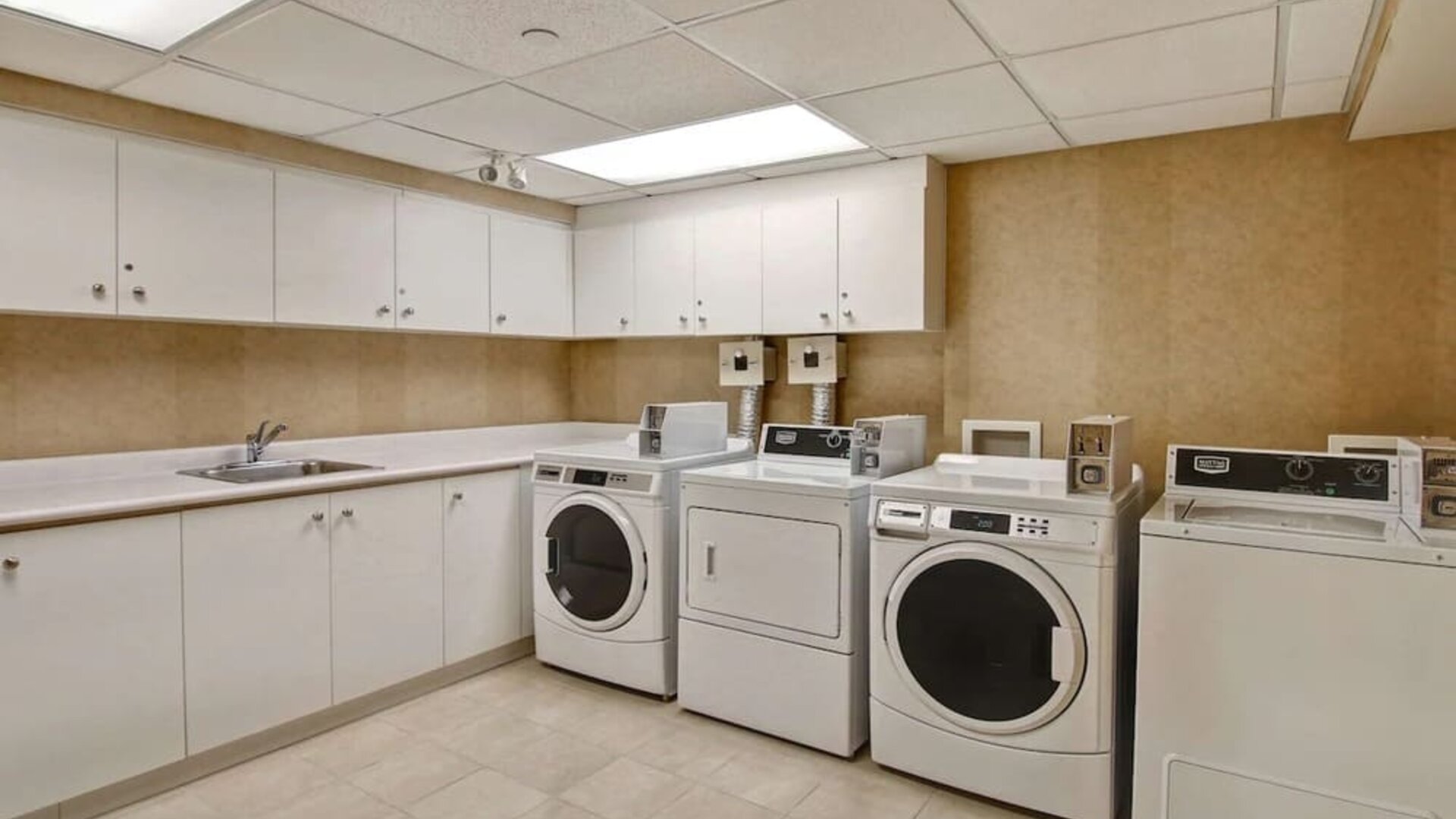 Laundry room at Homewood Suites By Hilton Burlington.