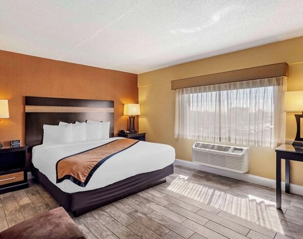 Day use room with sofa and work desk at Best Western Plus Newark Airport West.