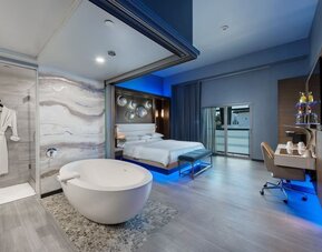 Spacious day use room with tub, work desk and balcony at Shade Hotel Manhattan Beach.