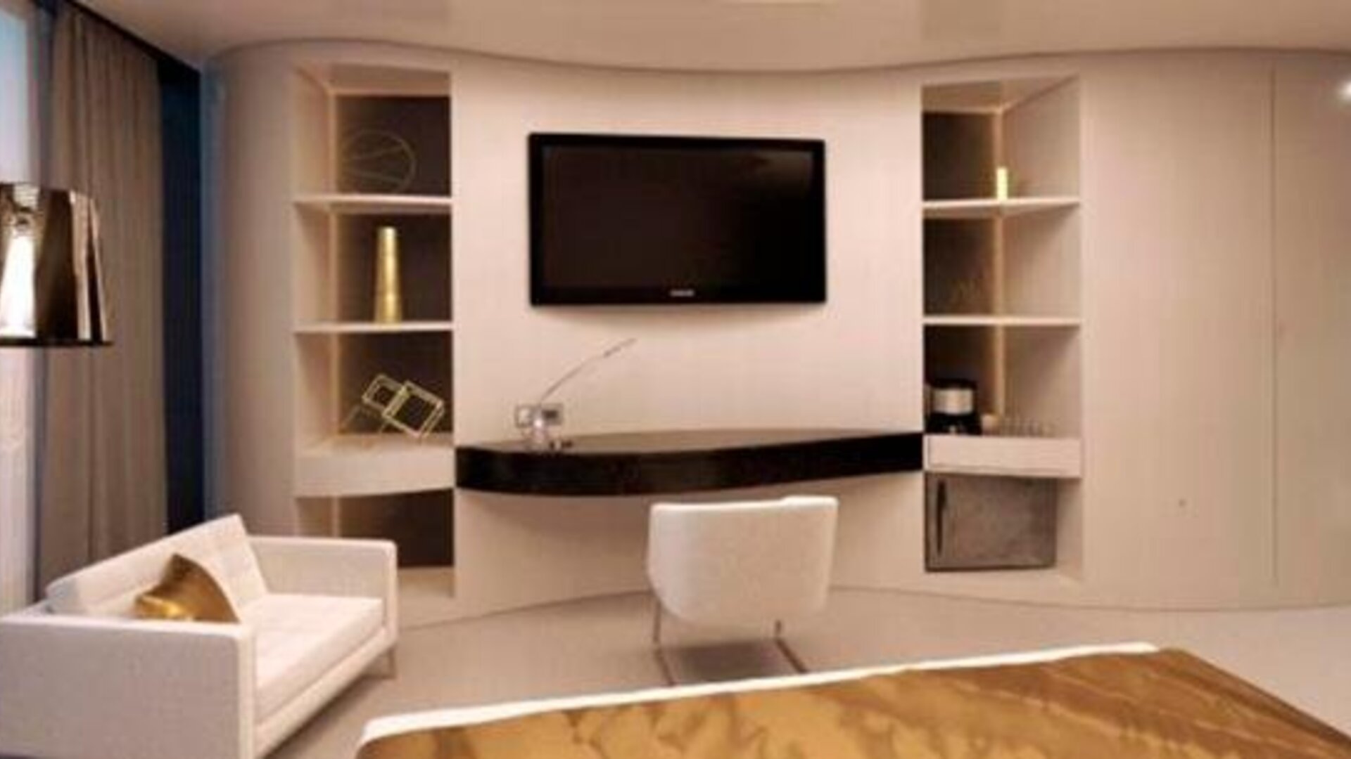 Contemporary guest suite with a wall-mounted television, cream seating, a desk and floor-to-ceiling windows at Hotel Las Américas Golden Tower Panamá.