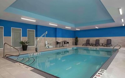 Relaxing indoor pool with lounge area at Hampton Inn By Hilton Port Hope.