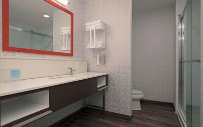 Private guest bathroom with toiletries at Hampton Inn By Hilton Port Hope.