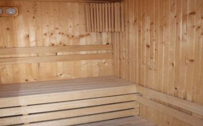 Wooden sauna room with tiered timber benches at Prima Music Eilat.