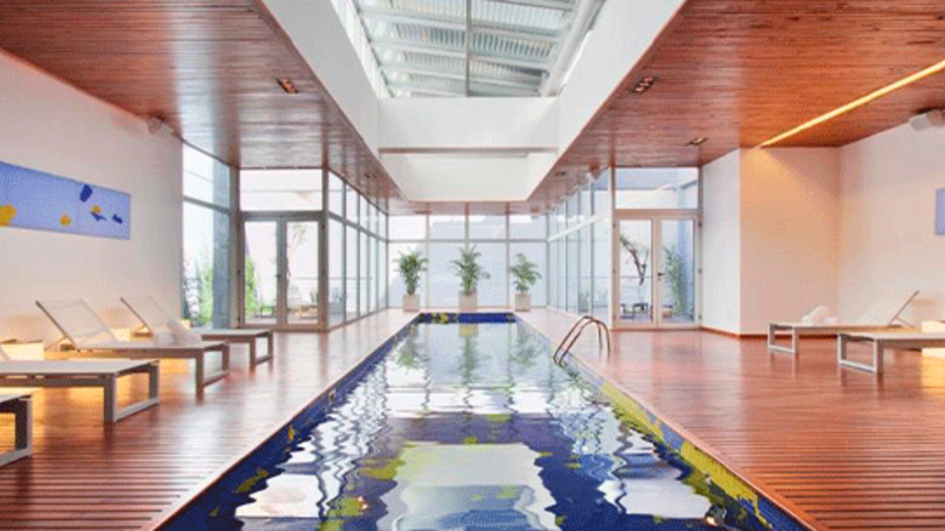 stick to the brief dumbass. Nexxt. Design Suites Buenos Aires.
Indoor swimming pool surrounded by wooden decking, white loungers and floor-to-ceiling windows at Design Suites Buenos Aires.