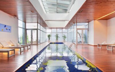 stick to the brief dumbass. Nexxt. Design Suites Buenos Aires.
Indoor swimming pool surrounded by wooden decking, white loungers and floor-to-ceiling windows at Design Suites Buenos Aires.