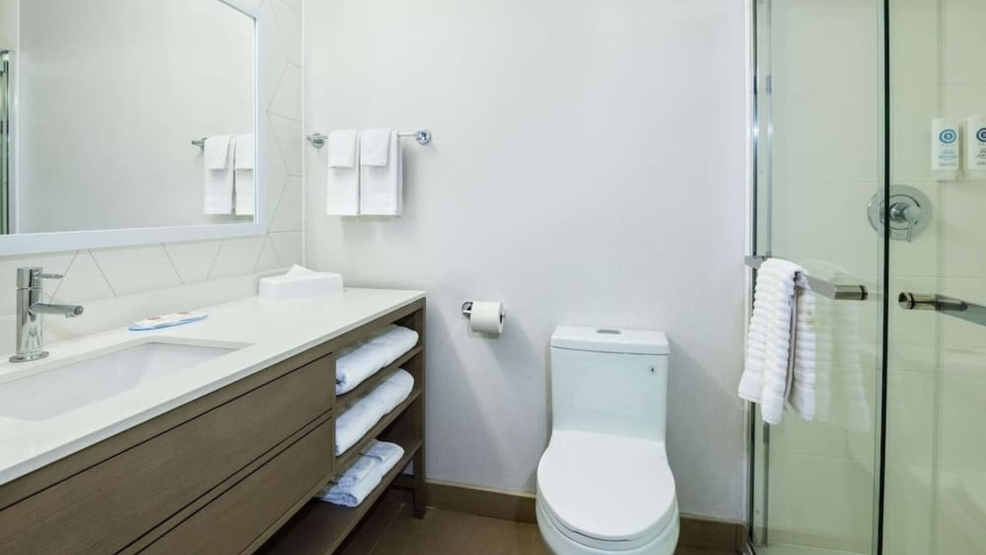 Private guest bathroom with shower and toiletries at Comfort Inn & Suites Barrie.