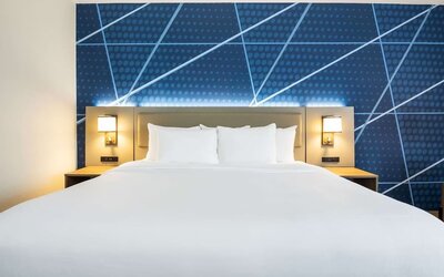 Comfortable king bed at Comfort Inn & Suites Barrie.