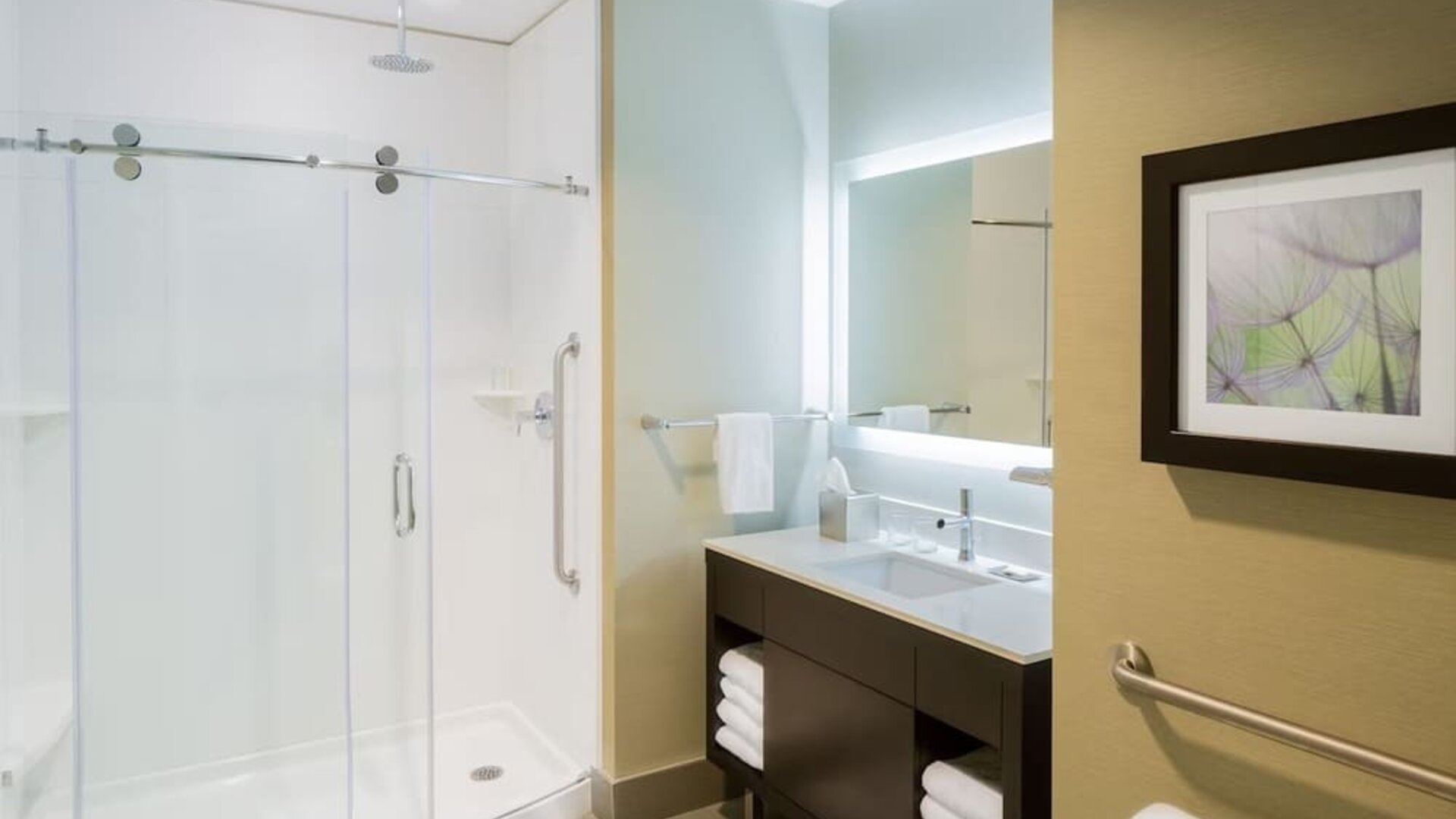 Private guest bathroom with shower at The Hollis Halifax - A DoubleTree Suites By Hilton.