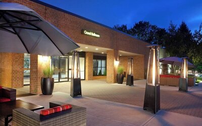 Outdoor seating at night at Boston Marriott Burlington.