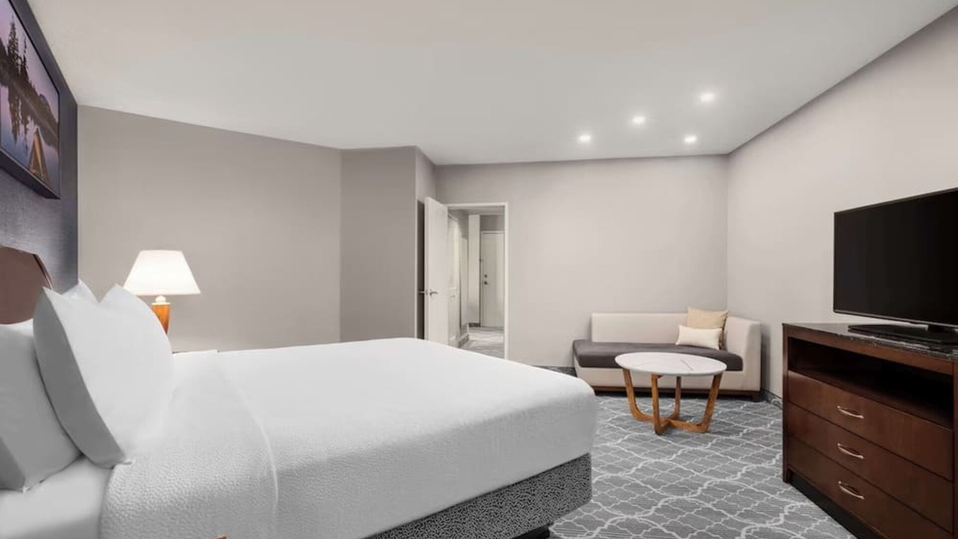 Standard day use room with TV, living area and private bathroom at Hilton Garden Inn Calgary Airport.