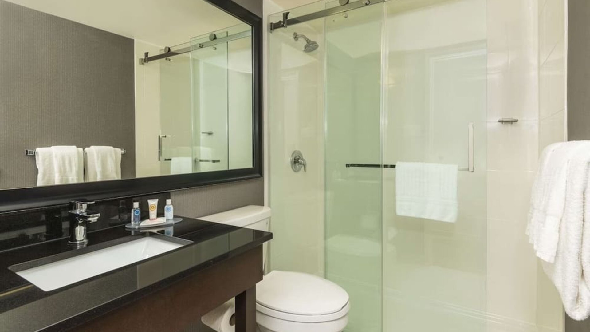 Guest bathroom with shower at Comfort Inn Sudbury East.