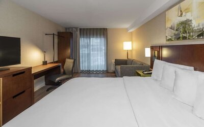 Day use room with work desk and sofa at Comfort Inn Sudbury East.