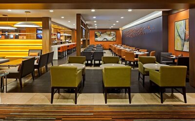 Dining area with comfortable seating at Hilton Mississauga Meadowvale.