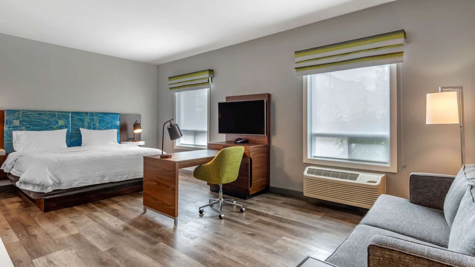 Day use studio suite with lounge area, work station and private bathroom at Hampton Inn & Suites By Hilton Edmonton/West.