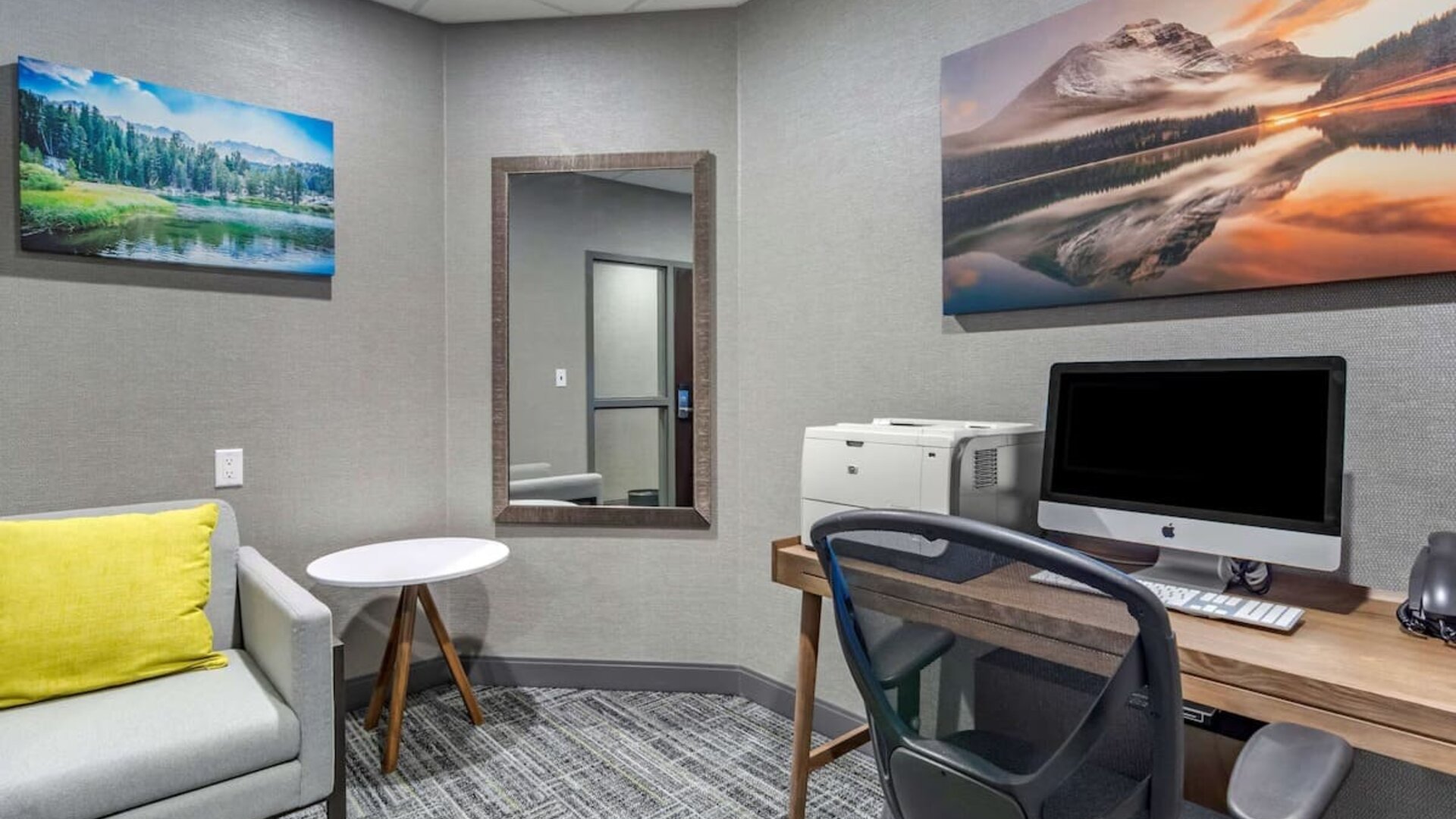 Business center with computer, printer, phone and comfortable mobiliary at Hampton Inn & Suites By Hilton Edmonton/West.
