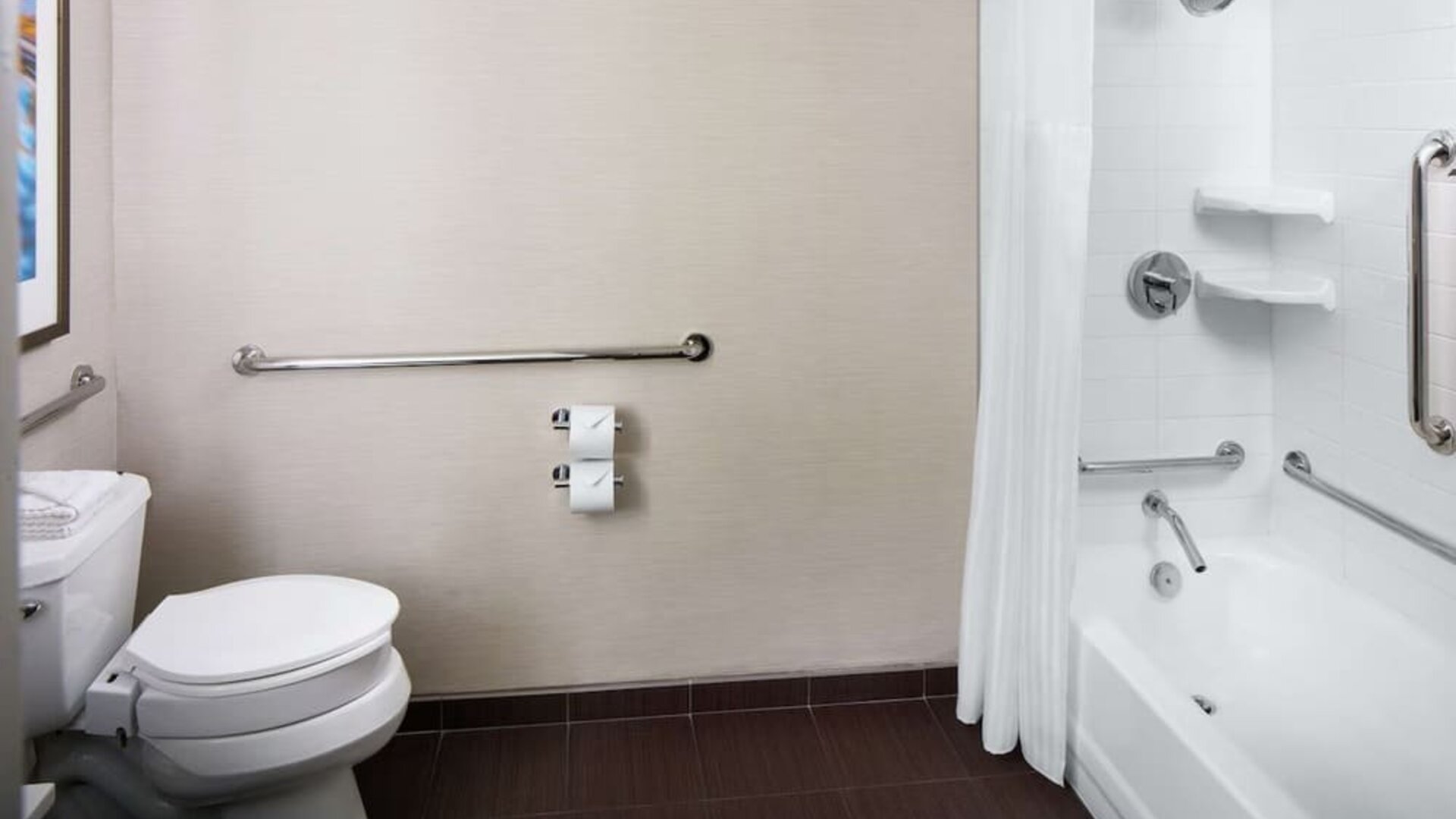 Guest bathroom with shower and tub at Hilton Albany.
