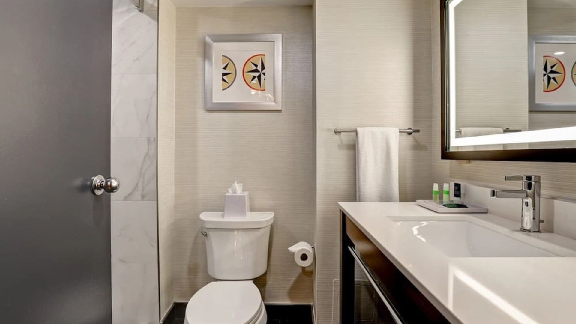 Private guest bathroom with shower and free toiletries at the Four Points By Sheraton St Catharines Niagara Suites. 