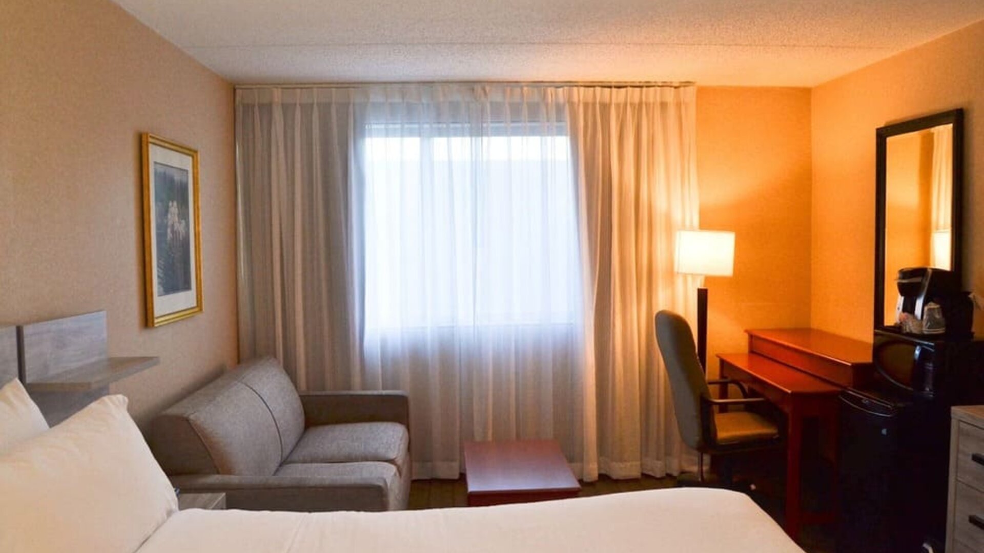 Day use room with sofa, work desk, mini bar and private bathroom at Amenida Residences.