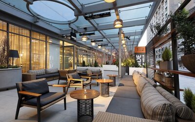 Veranda with ample seats at Innside By Melia New York Nomad.