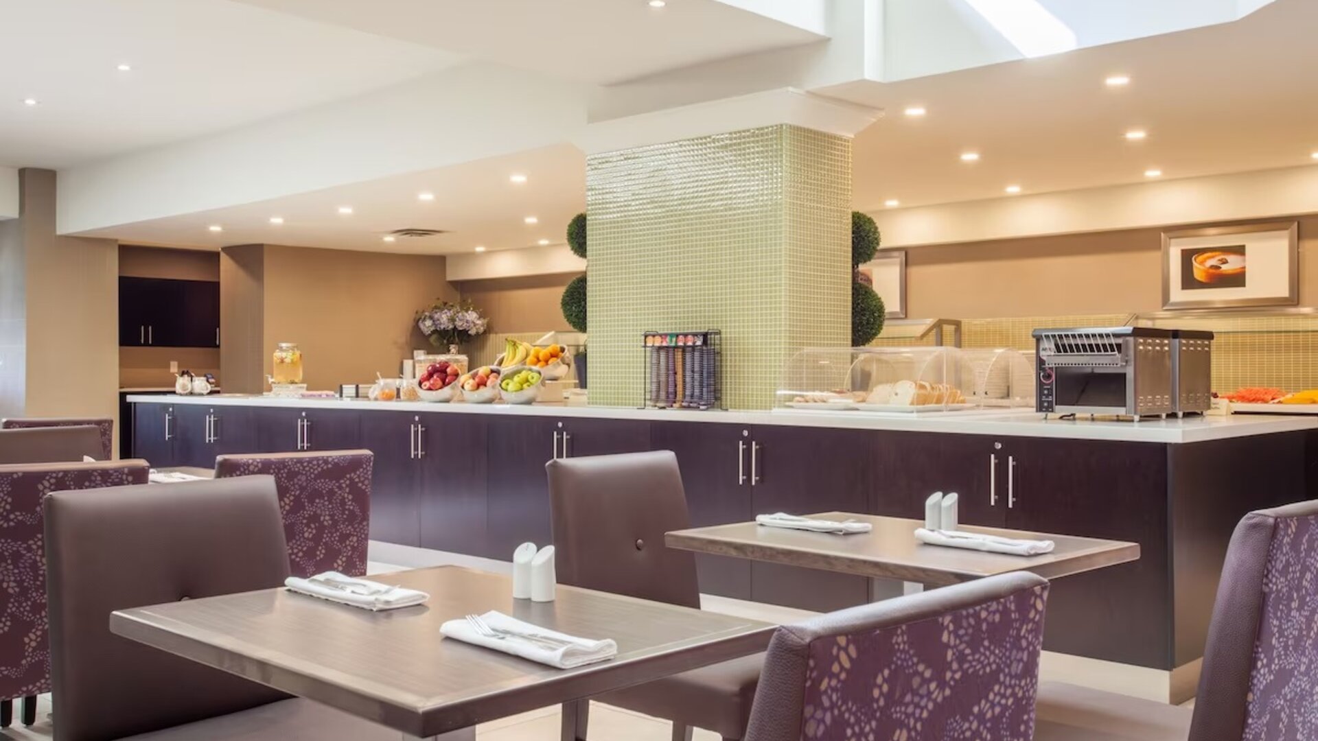 Dining area with comfortable seating at Holiday Inn Toronto International Airport.