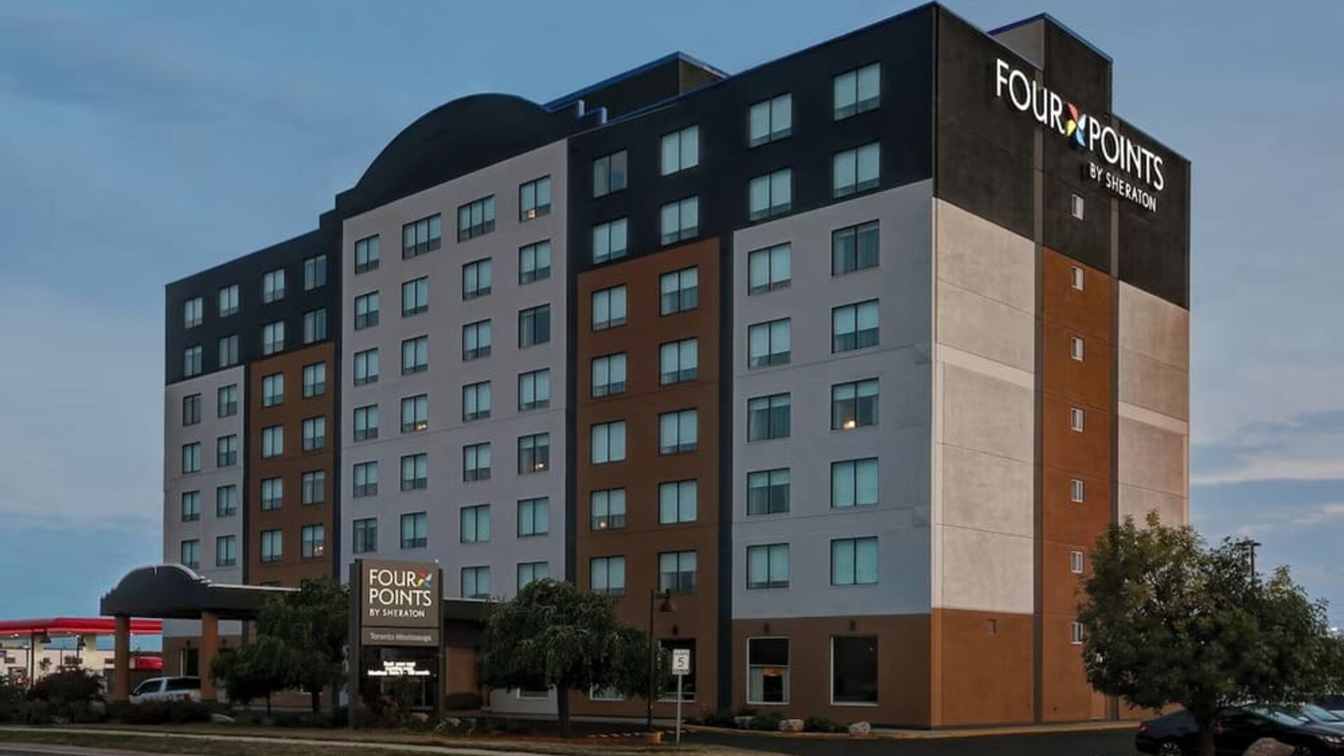 Hotel exterior and parking area at Four Points By Sheraton Toronto Mississauga.