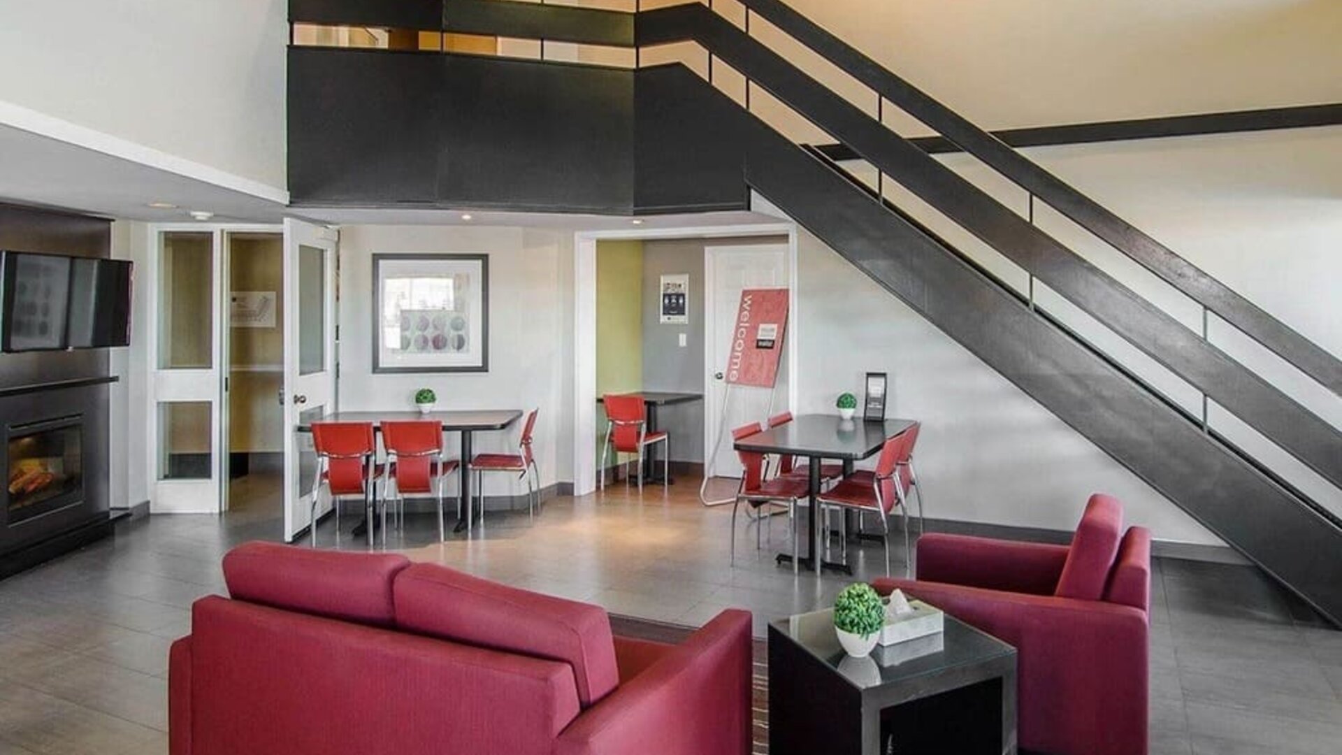 Hotel lobby and lounge area with fireplace, perfect for co-working at Comfort Inn Swift Current.