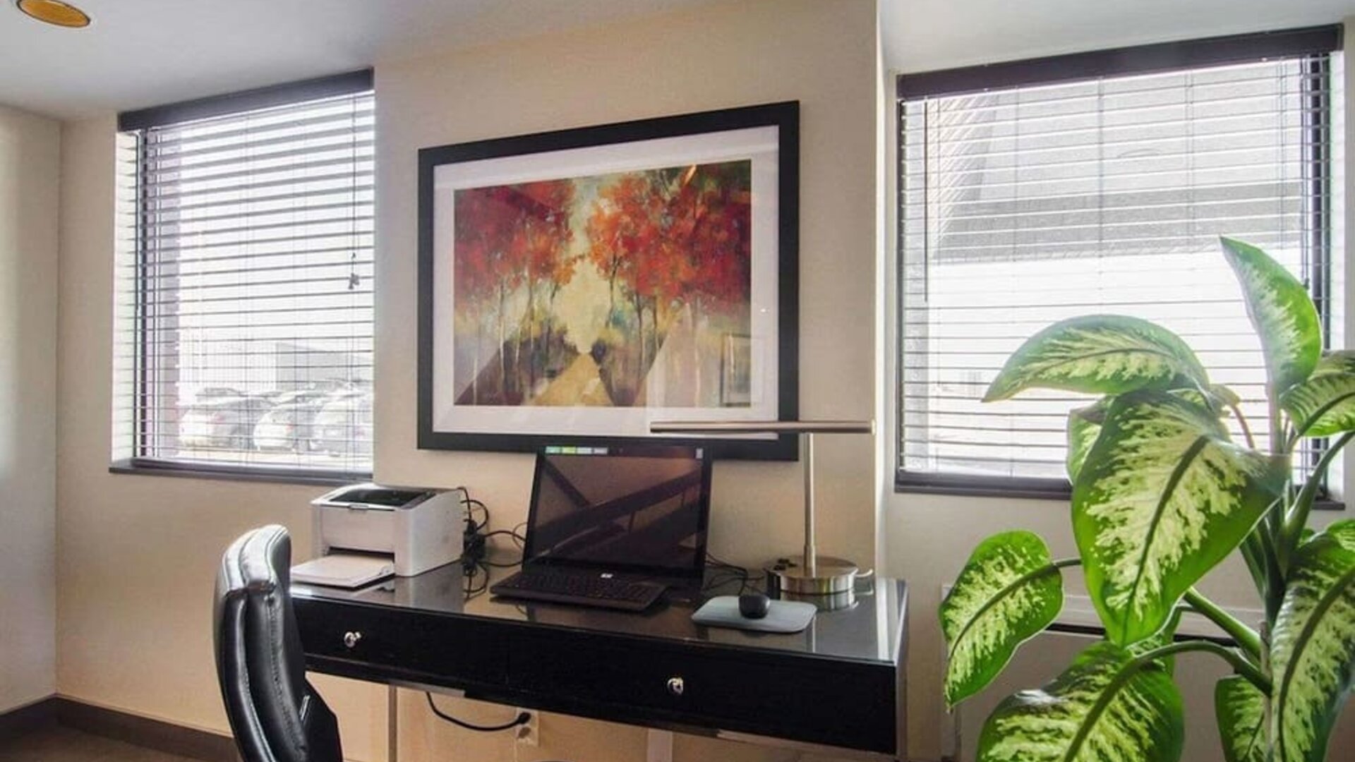 Business center with computer, printer and ergonomic chair at Comfort Inn Swift Current.
