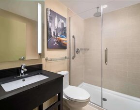 Guest bathroom with shower at Best Western Premier Herald Square.