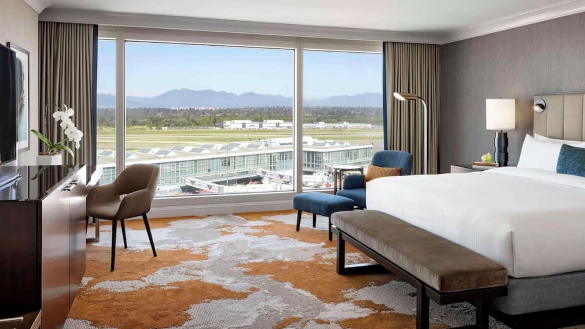 Bright and spacious day use room with TV, sofa, work desk and private bathroom at Fairmont Vancouver Airport - YVR Terminal Hotel.