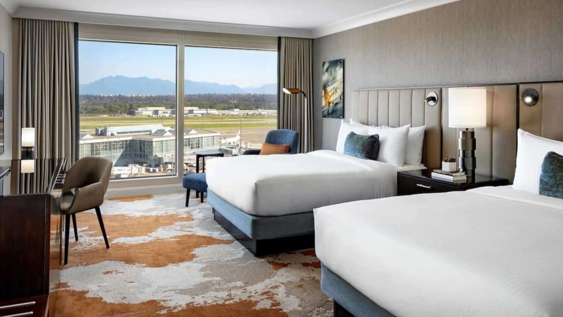 Bright and spacious day use twin room with TV, sofa, work desk and private bathroom at Fairmont Vancouver Airport - YVR Terminal Hotel.