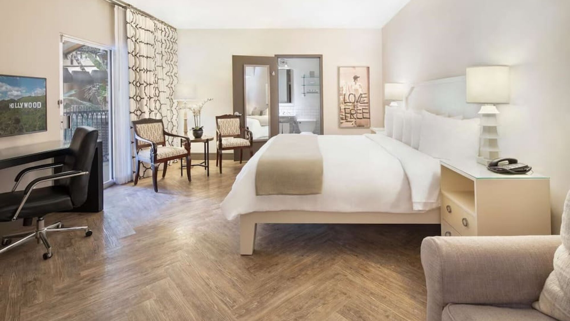 King bedroom with sofa at Hollywood Hotel.