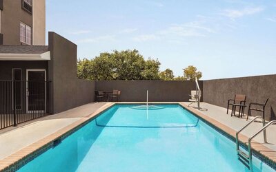 Refreshing outdoor pool at La Quinta Inn & Suites - North Stone Oak.