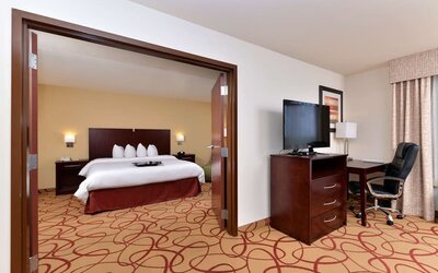 Day use room with living area and work desk at Hampton Inn Deer Park.