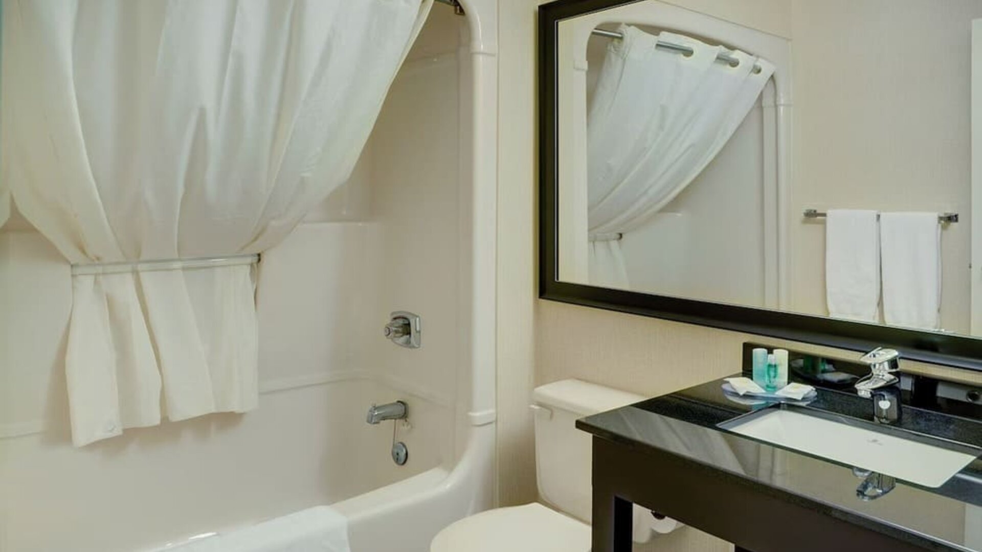 Guest bathroom with tub and free toiletries at Comfort Inn Prince Albert.