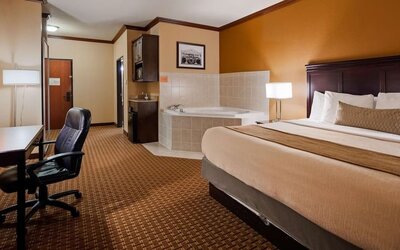 Day use room with bath tub and work desk at Best Western Granbury Inn & Suites.