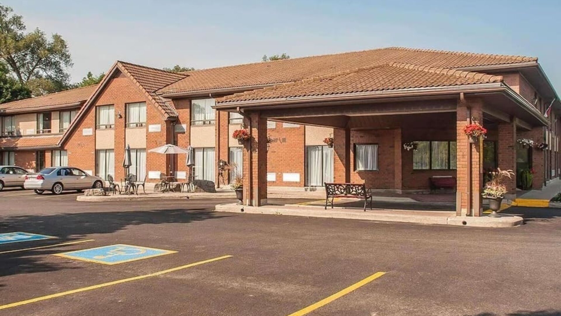Hotel entrance and parking area at Comfort Inn Orillia.