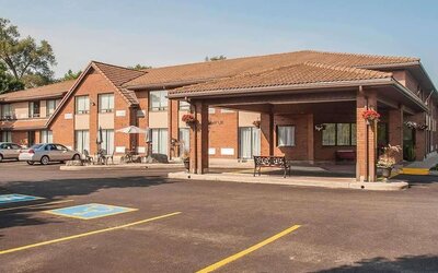 Hotel entrance and parking area at Comfort Inn Orillia.