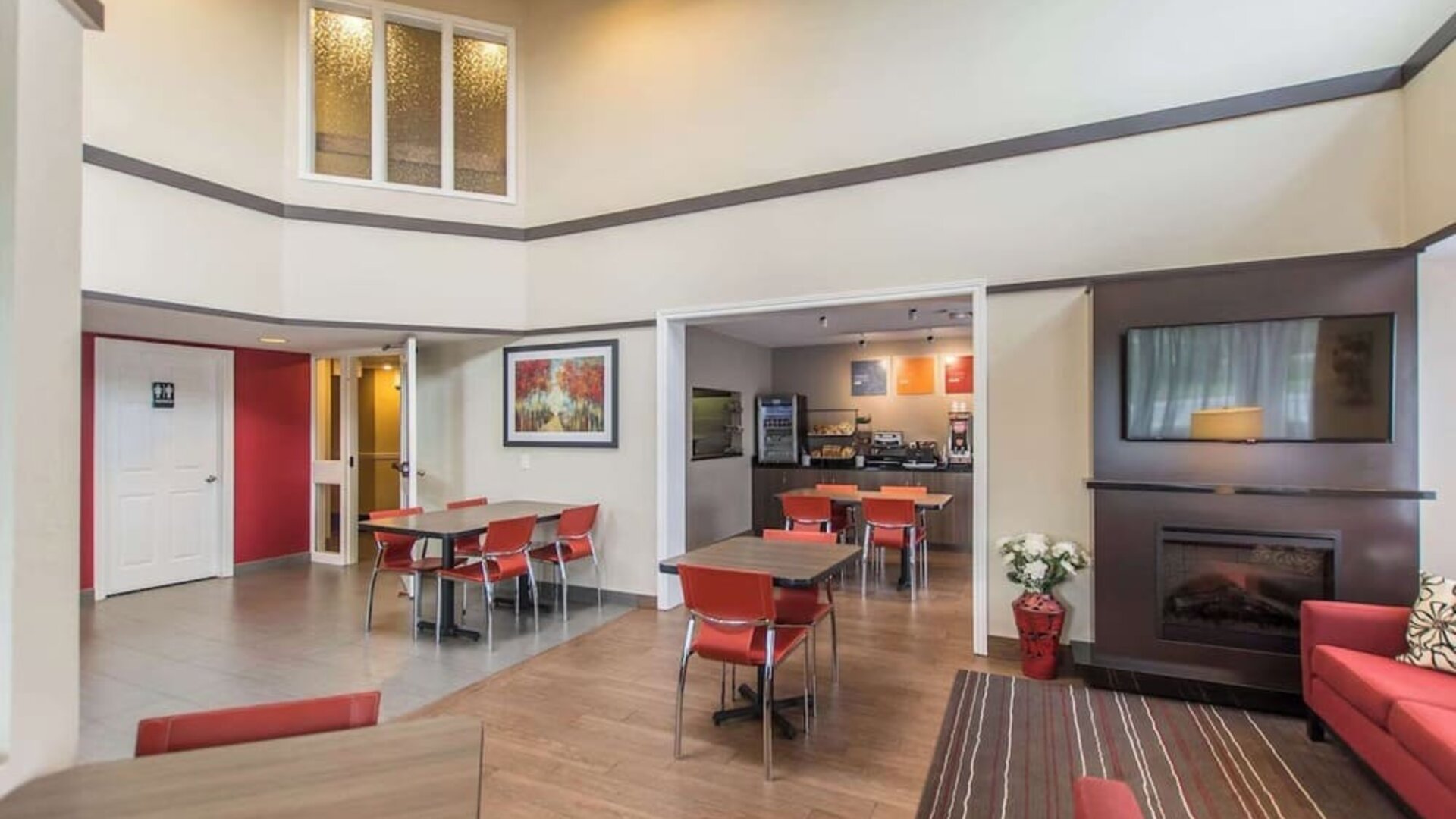 Lobby lounge with fireplace and comfortable sitting at Comfort Inn New Glasgow.