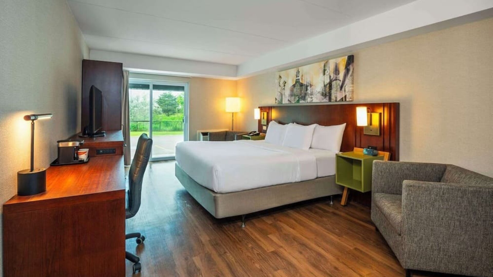 Day use room with TV, sofa, work desk and private bathroom at Comfort Inn Newmarket.