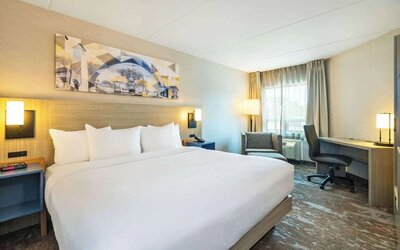 Bright and spacious day use room with work desk and sofa at Comfort Inn Kingston HWY 401.