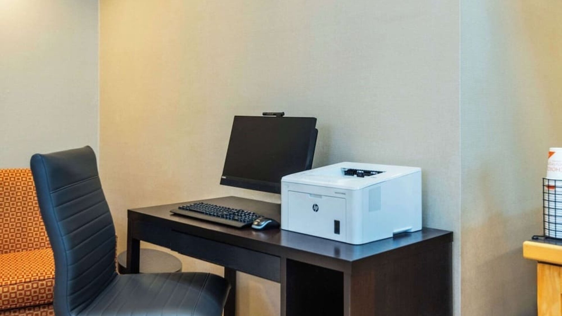 Business center with computer, printer and ergonomic chair at Comfort Inn Kingston HWY 401.