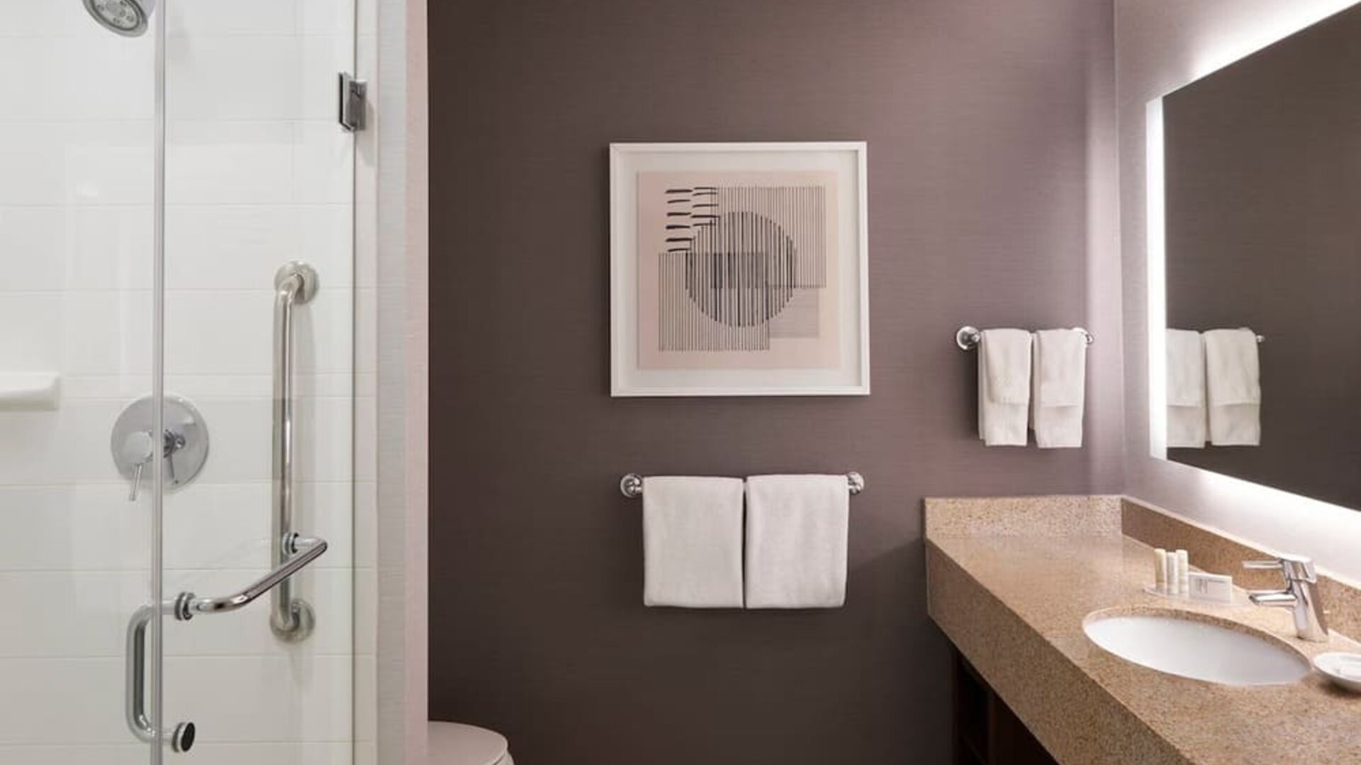 Guest bathroom with shower and free toiletries at Courtyard By Marriott Waterloo St. Jacobs.