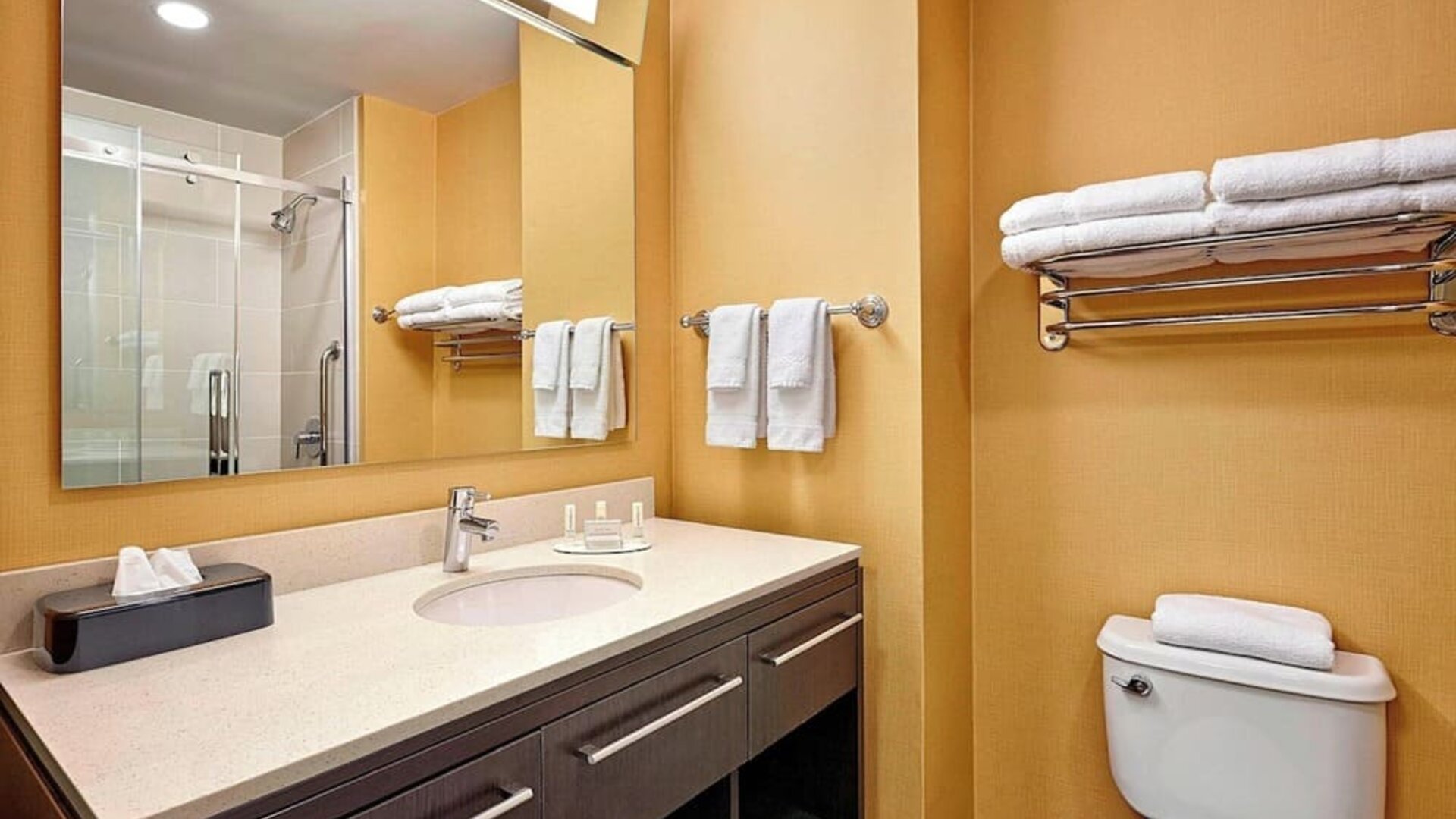 Guest bathroom with shower and free toiletries at TownePlace Suites By Marriott London.