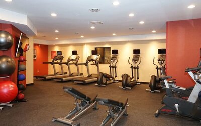 Fully equipped fitness center at TownePlace Suites By Marriott London.