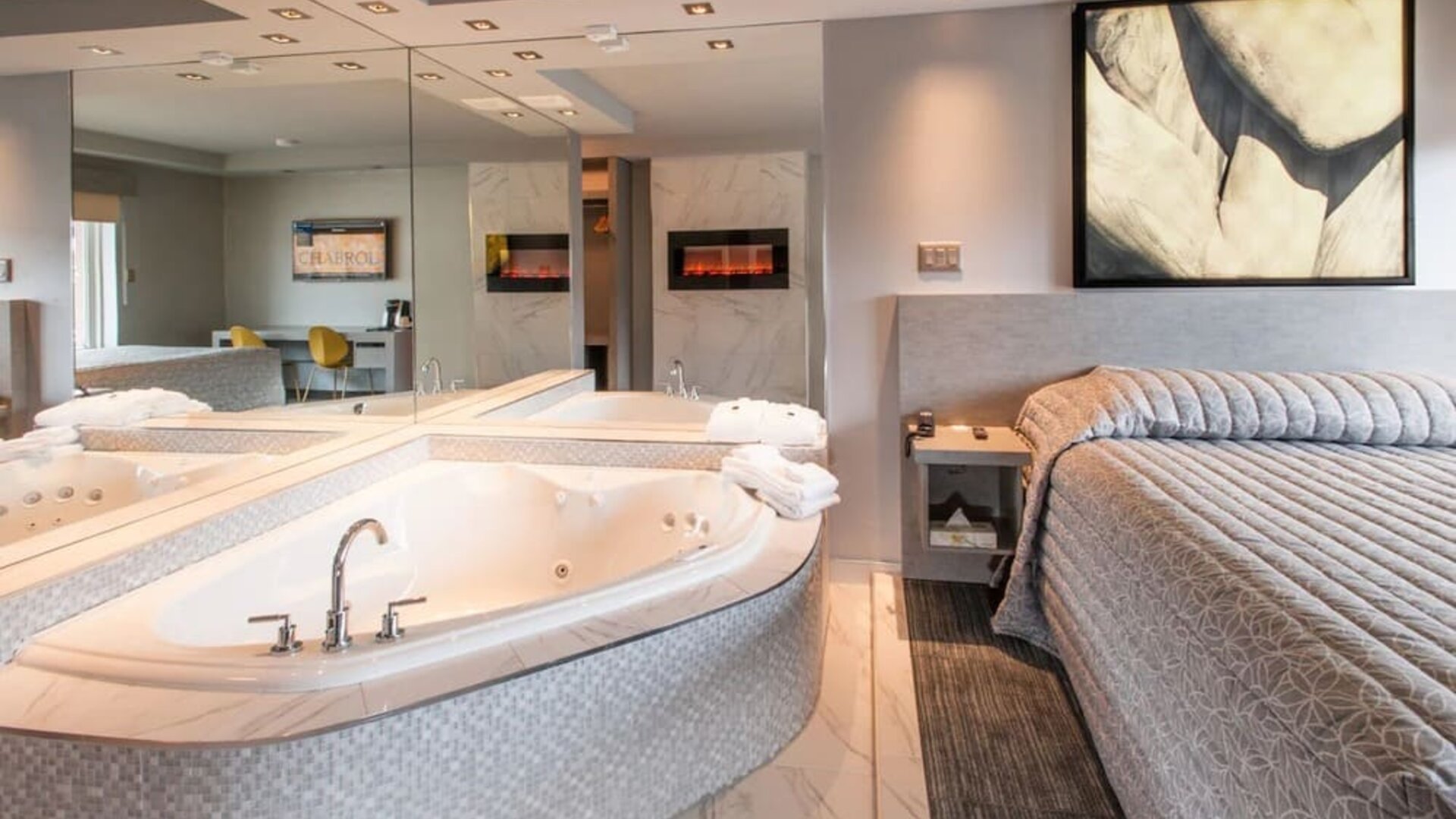 Day use suite with hot tub and fireplace at Le Chabrol Hotel Et Suites.q