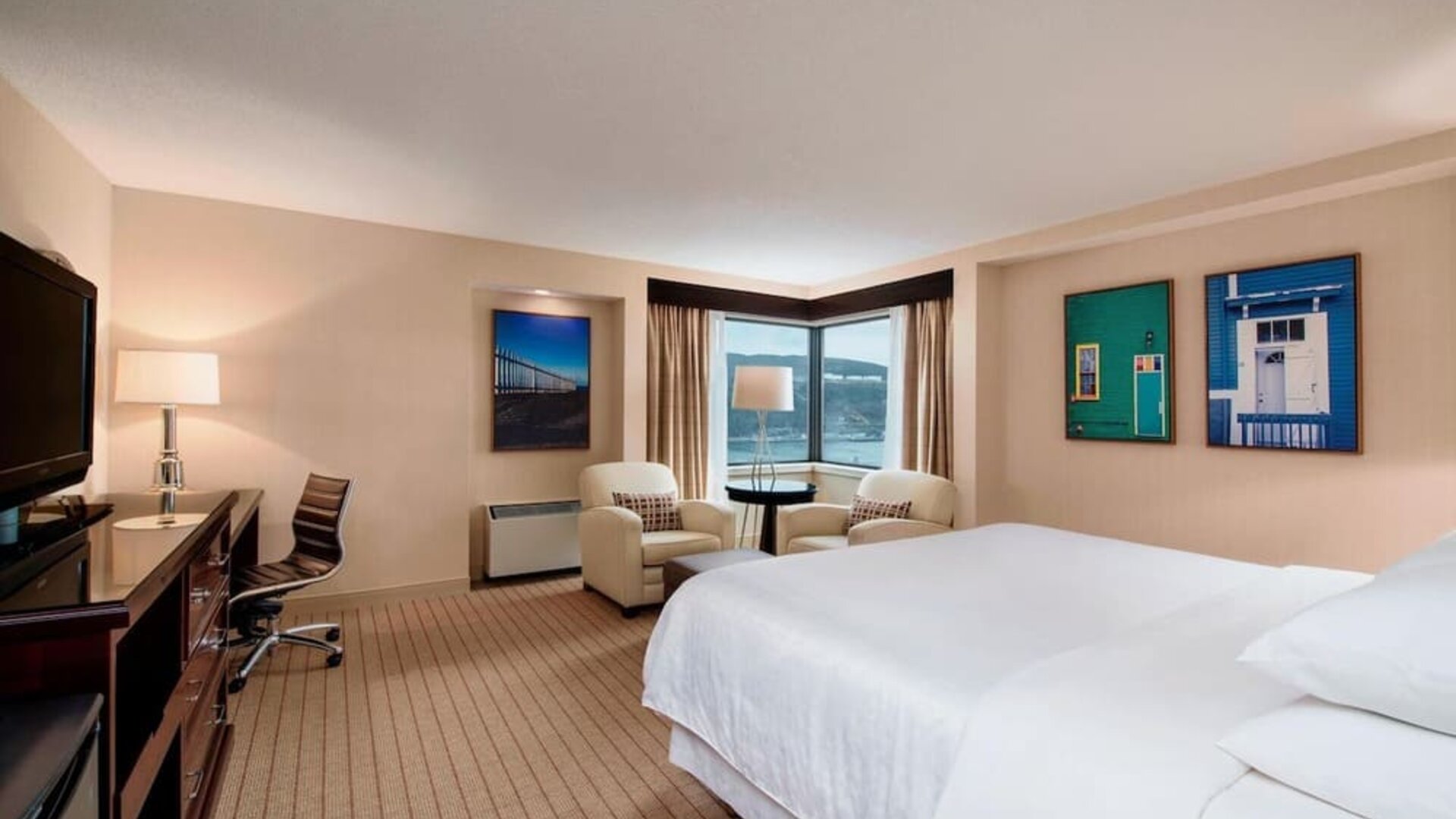 Standard day use room with TV, work desk and lounge area at Sheraton Hotel Newfoundland.