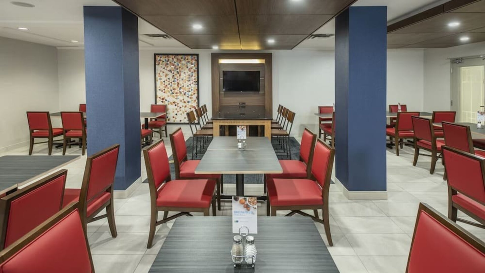 Dining area with comfortable seating at Holiday Inn Express & Suites Medicine Hat.