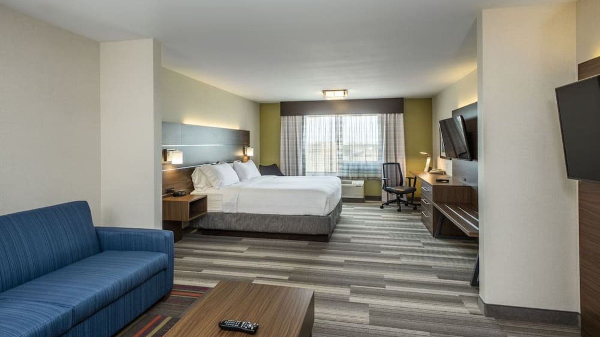 Day use suite with work desk and living area at Holiday Inn Express & Suites Medicine Hat.