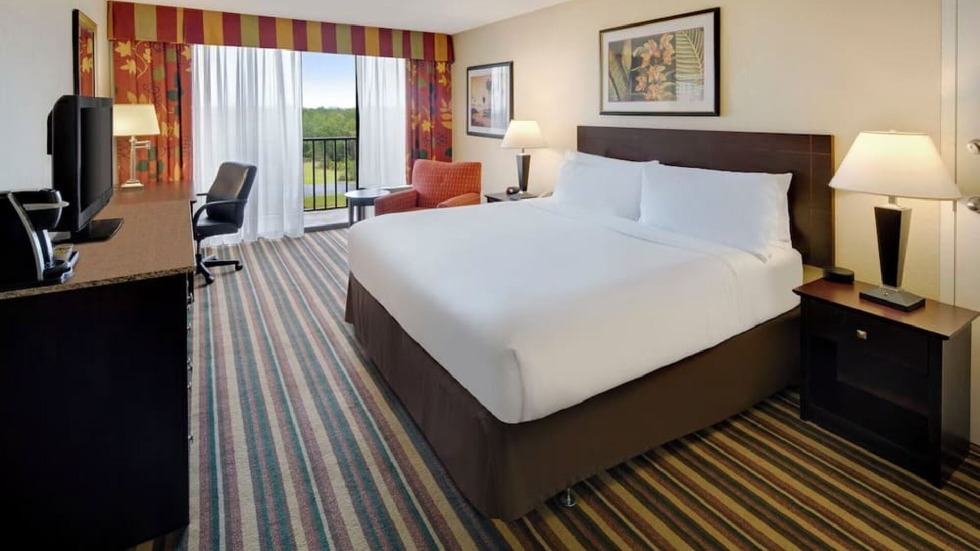 Day use room with balcony and work desk at Holiday Inn Orlando SW - Celebration Area.